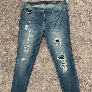 Distressed denim jeans